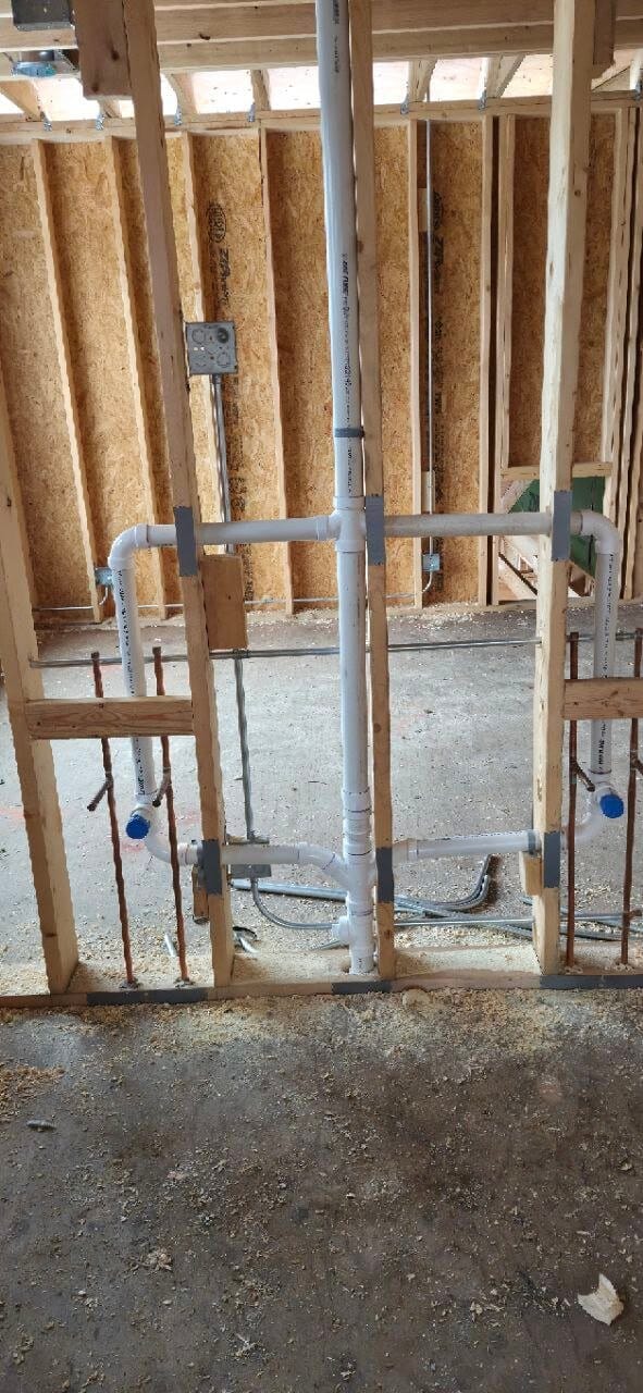 Drain and water supply rough-in in a framed wall