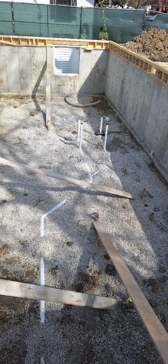 Underground drain lines laid out inside a new foundation